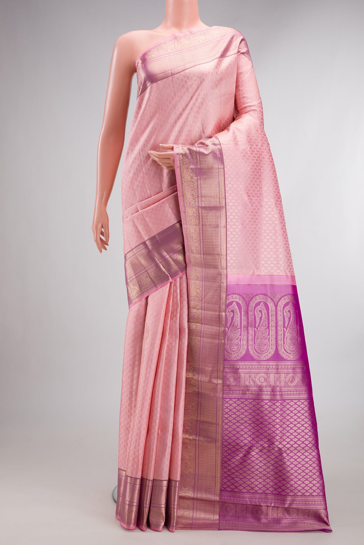 Pure Silk Rose pink Kanchipuram Saree with Zari Brocade on the body and Fancy Border.  displayed on a mannequin