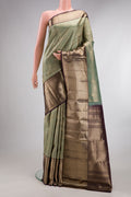 Pure Silk Green Kanchipuram Saree with Zari Brocade on the body and Zari Border.  displayed on a mannequin