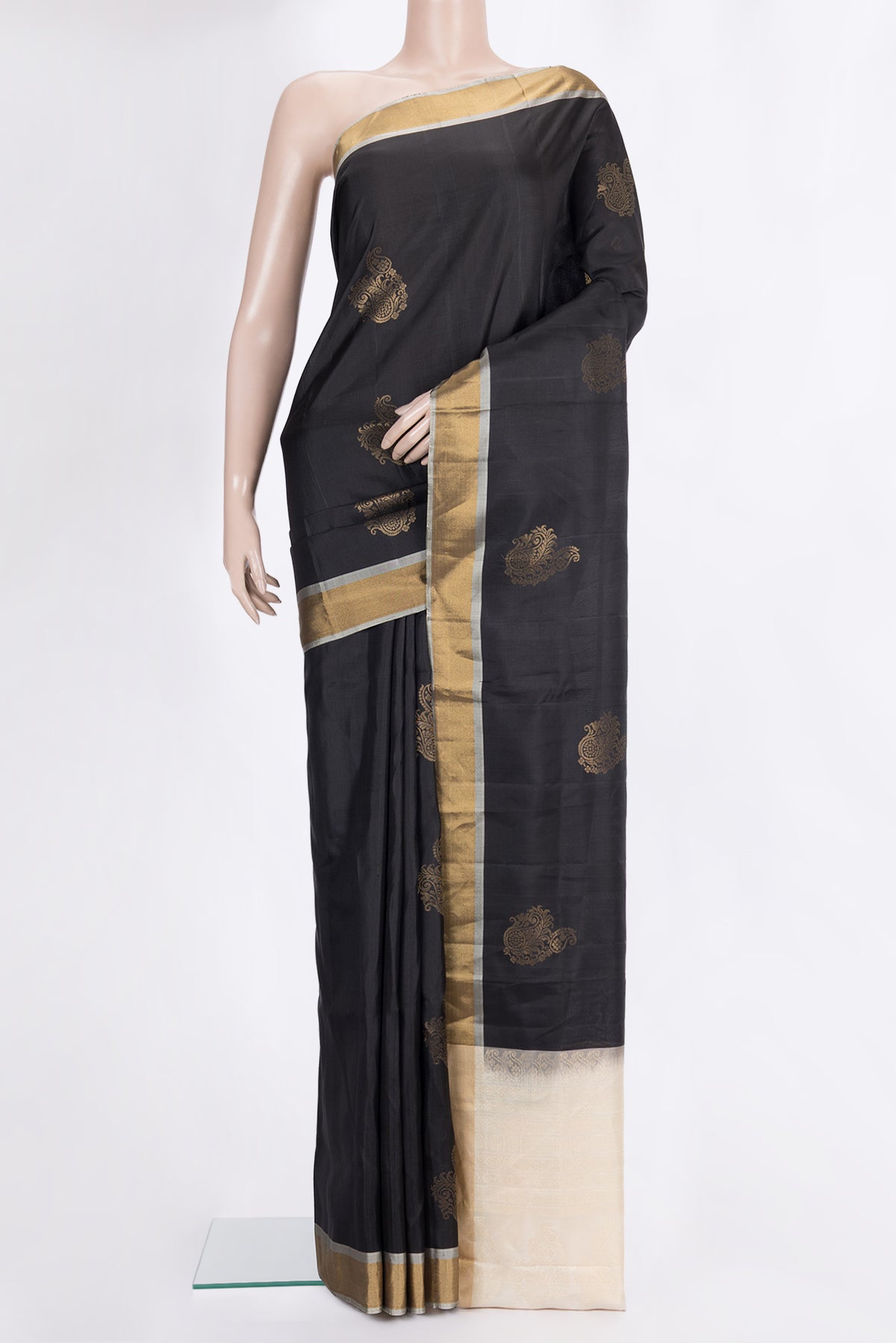 Pure Silk Black Soft Saree with Zari Butta on the body and Zari Border.  displayed on a mannequin