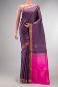 Pure Silk Mauve Soft Saree with Zari Butta on the body and Zari Border.  displayed on a mannequin