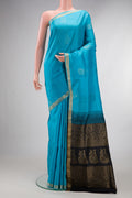 Pure Silk Sky Blue Soft Saree with Zari Butta on the body and Zari Border.  displayed on a mannequin