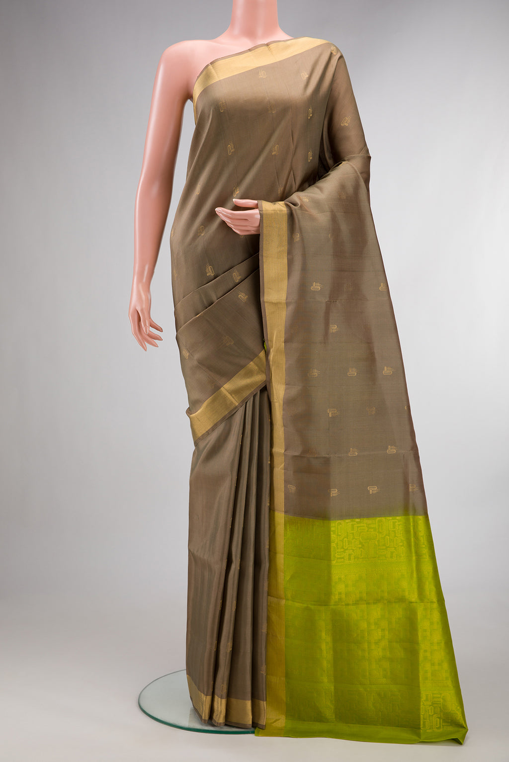 Pure Silk Brown Soft Saree with Zari Butta on the body and Zari Border.  displayed on a mannequin