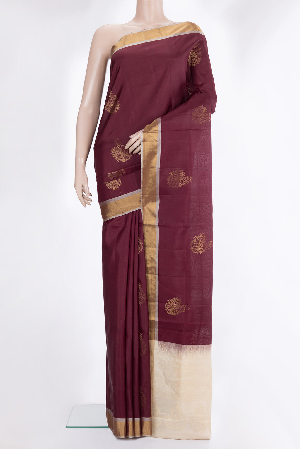 Pure Silk Brown Soft Saree with Zari Butta on the body and Zari Border.  displayed on a mannequin