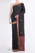 Pure Silk Black Soft Saree with Zari Butta on the body and Zari Border.  displayed on a mannequin