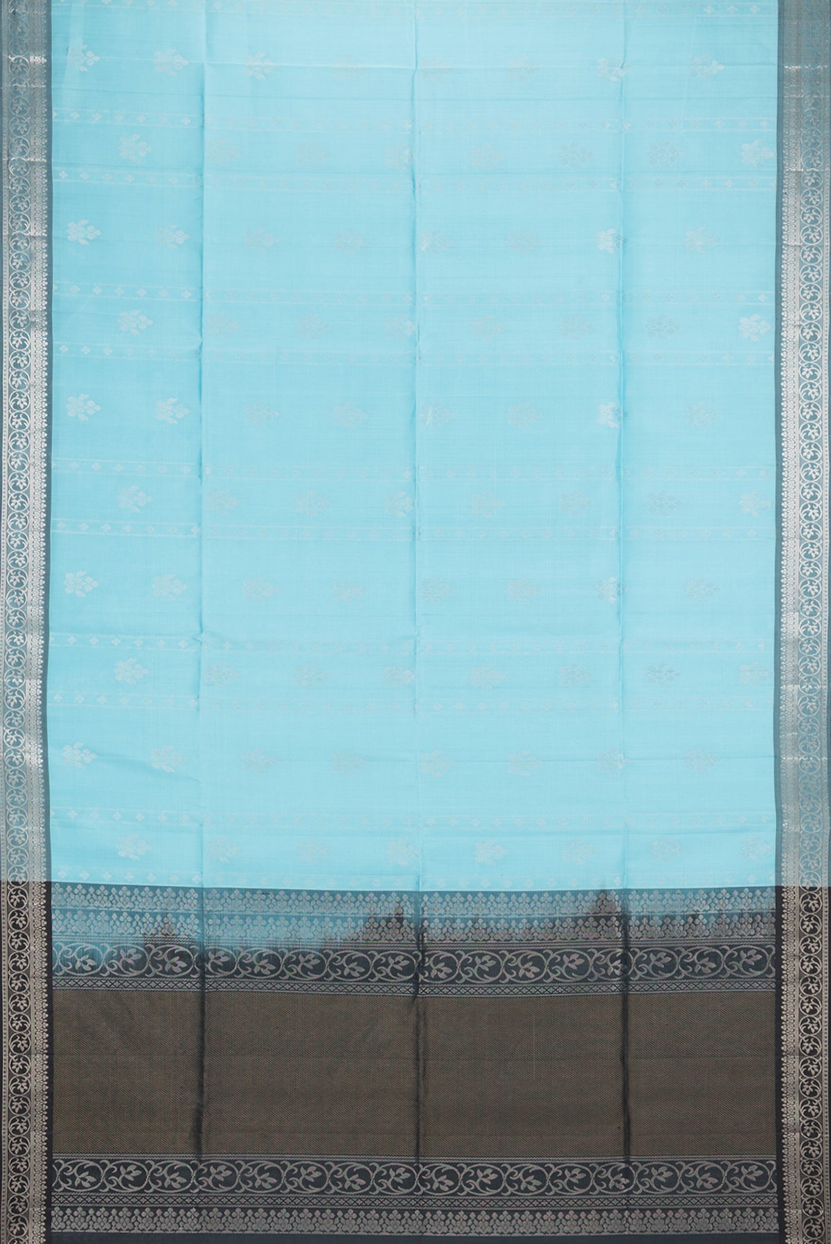 Flat view of Pure Silk Sky Blue Soft Saree with Zari Butta on the body and Zari Border. 