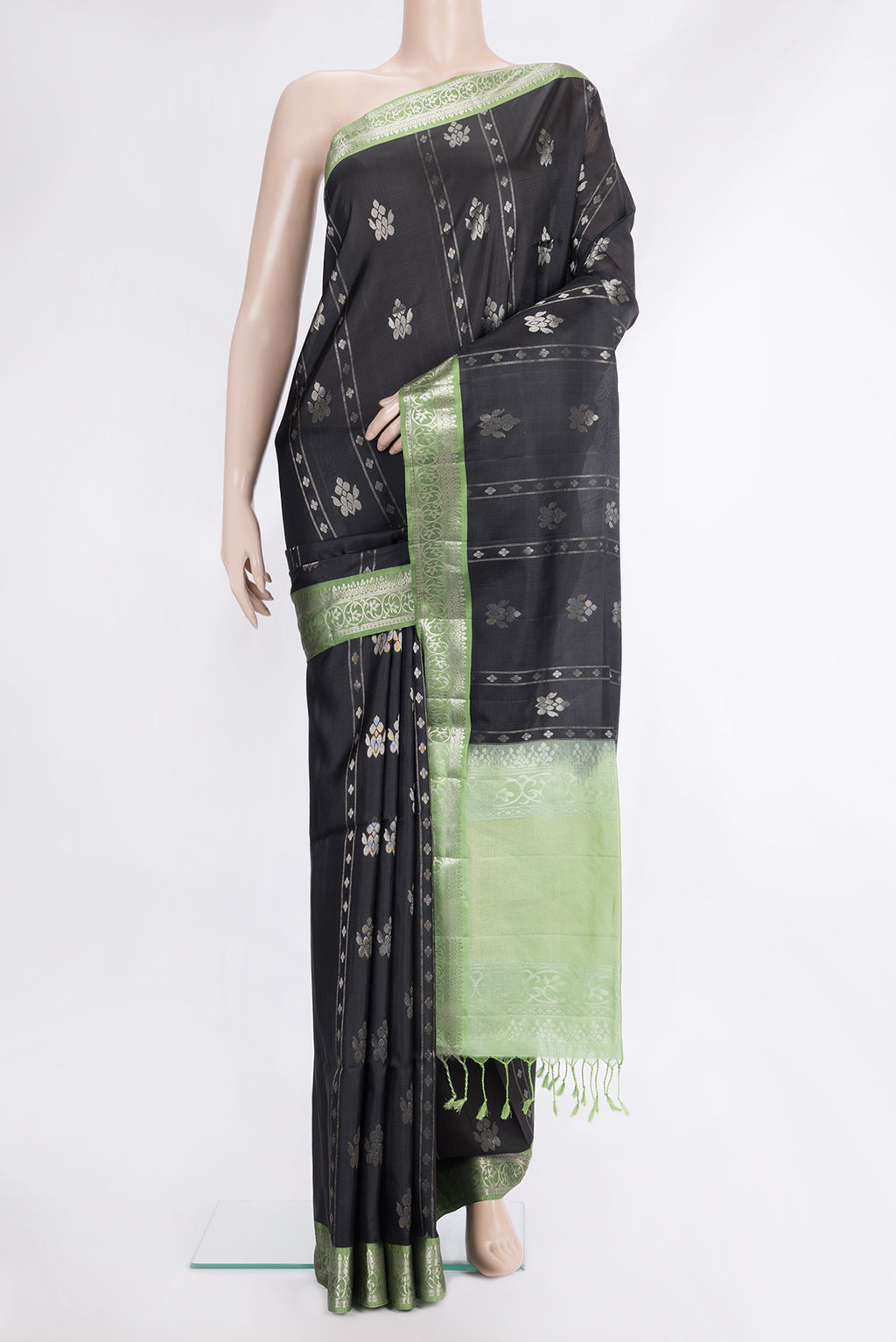 Pure Silk Black Soft Saree with Zari Butta on the body and Zari Border.  displayed on a mannequin