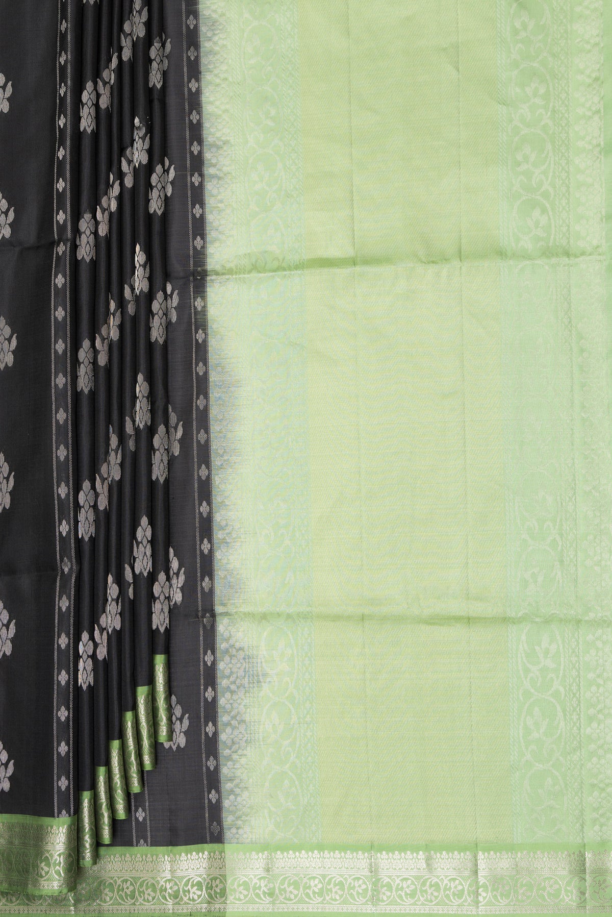 Pleats and pallu of Pure Silk Black Soft Saree with Zari Butta on the body and Zari Border. 
