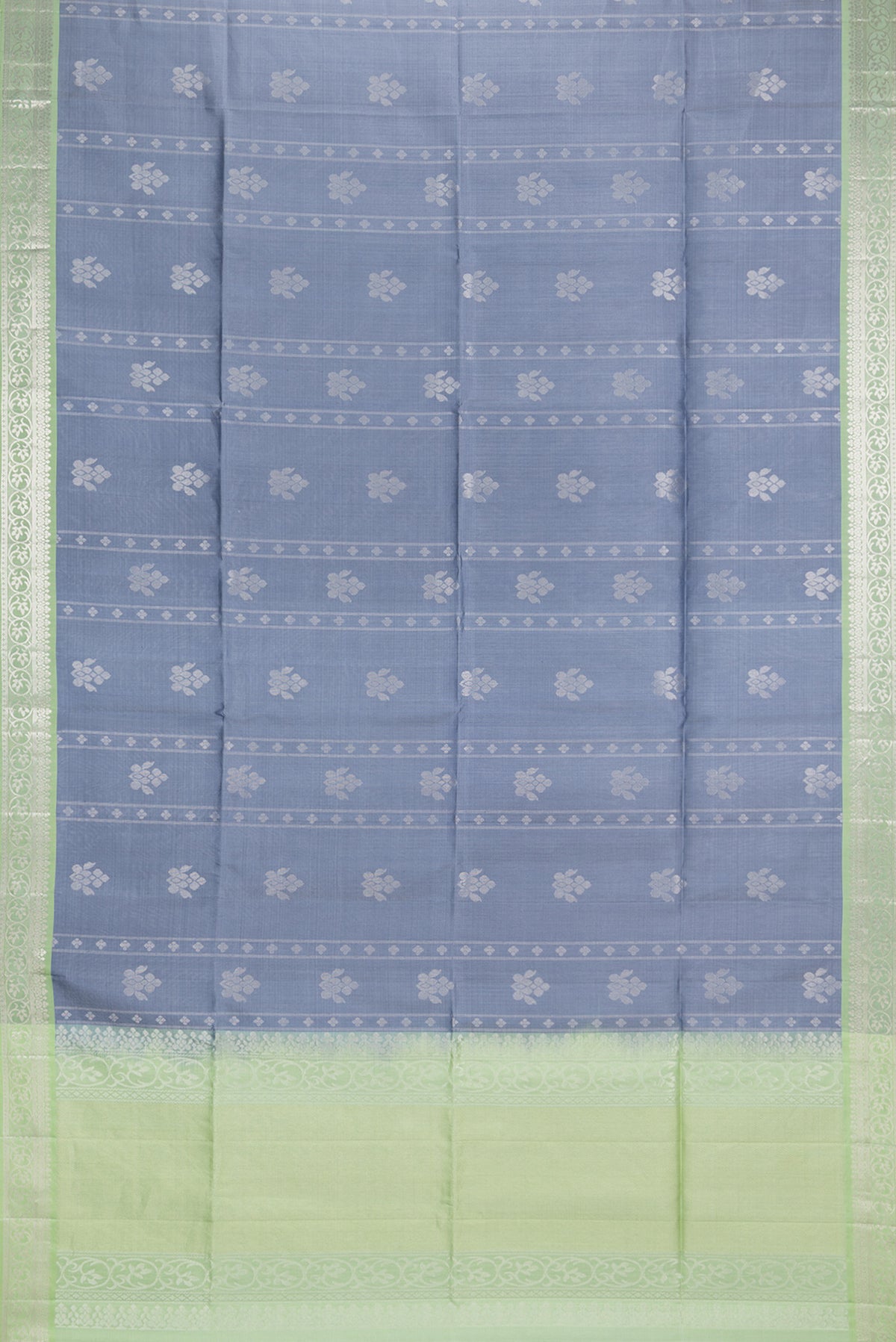 Flat view of Pure Silk Grey Dual Tone Soft Saree with Zari Butta on the body and Zari Border. 
