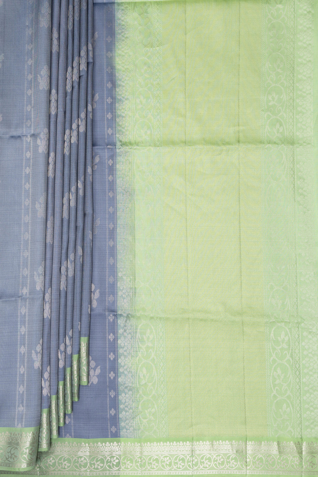 Pleats and pallu of Pure Silk Grey Dual Tone Soft Saree with Zari Butta on the body and Zari Border. 