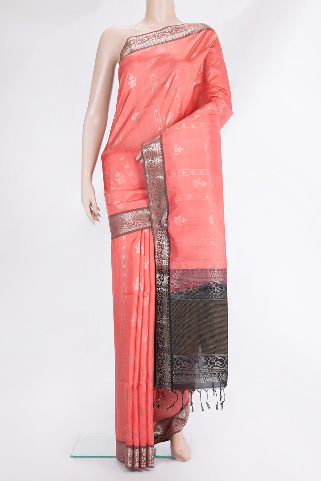 Pure Silk Coral Soft Saree with Zari Butta on the body and Zari Border.  displayed on a mannequin