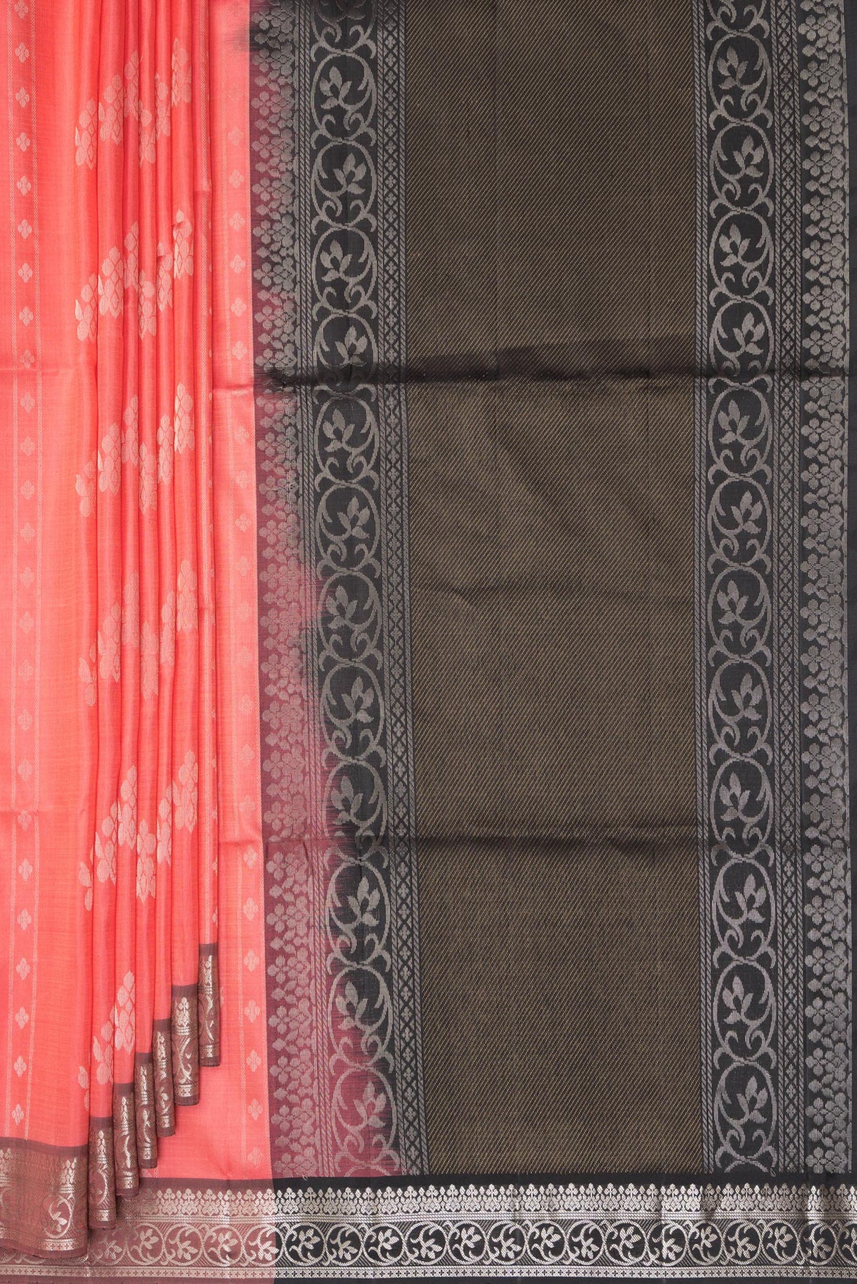 Pleats and pallu of Pure Silk Coral Soft Saree with Zari Butta on the body and Zari Border. 