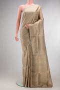 Pure Silk Beige Soft Saree with Zari Brocade on the body and Zari Border.  displayed on a mannequin