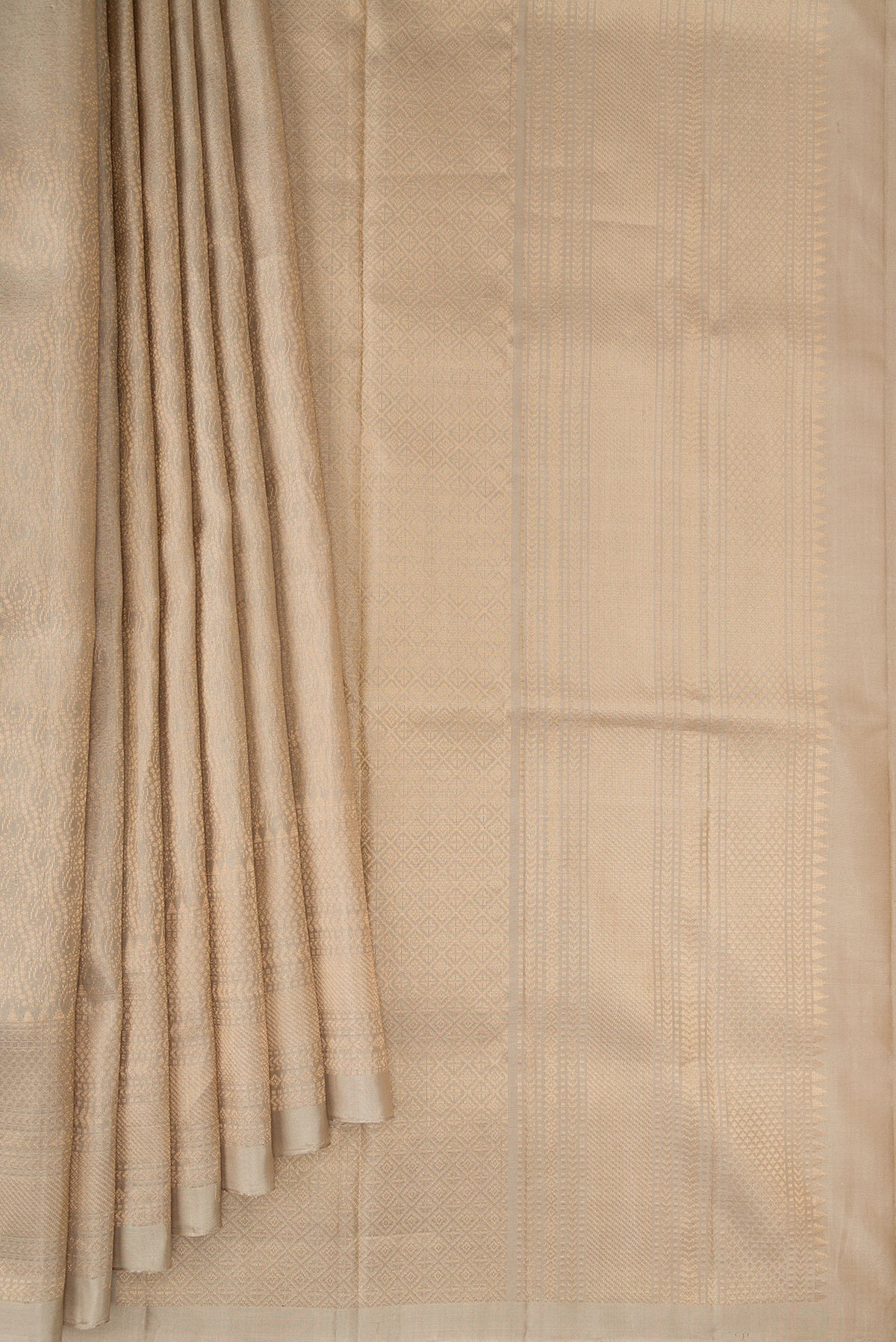 Pleats and pallu of Pure Silk Beige Soft Saree with Zari Brocade on the body and Zari Border. 