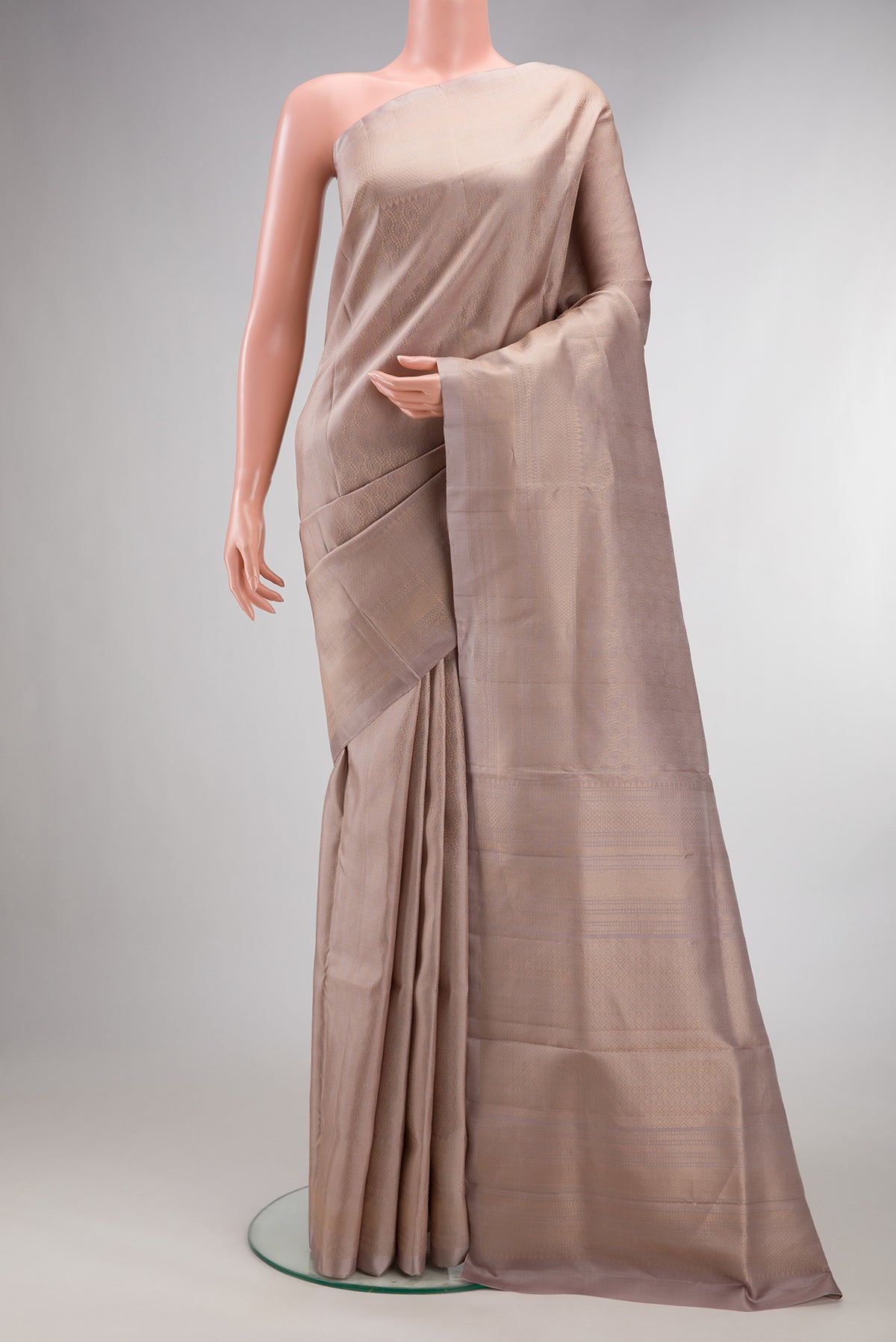 Pure Silk Dark Beige Soft Saree with Zari Brocade on the body and Fancy Border.  displayed on a mannequin