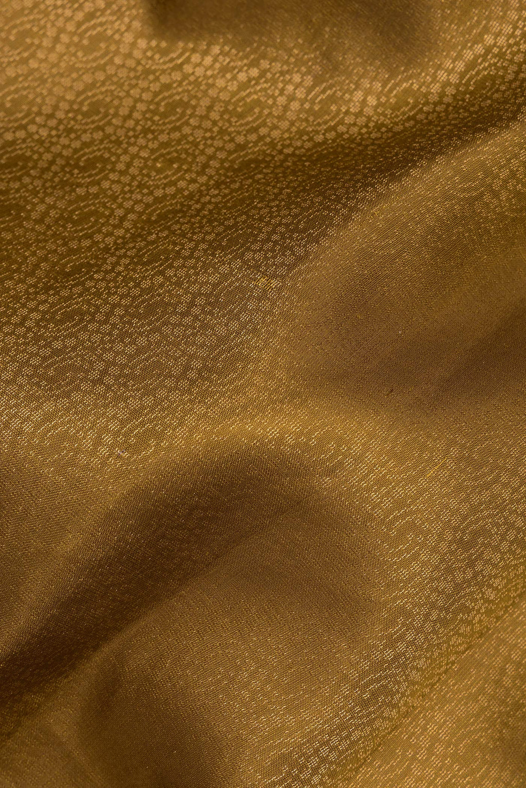 Close up of Pure Silk Mehandi Green Soft Saree with Zari Brocade on the body and Zari Border.  displaying folds
