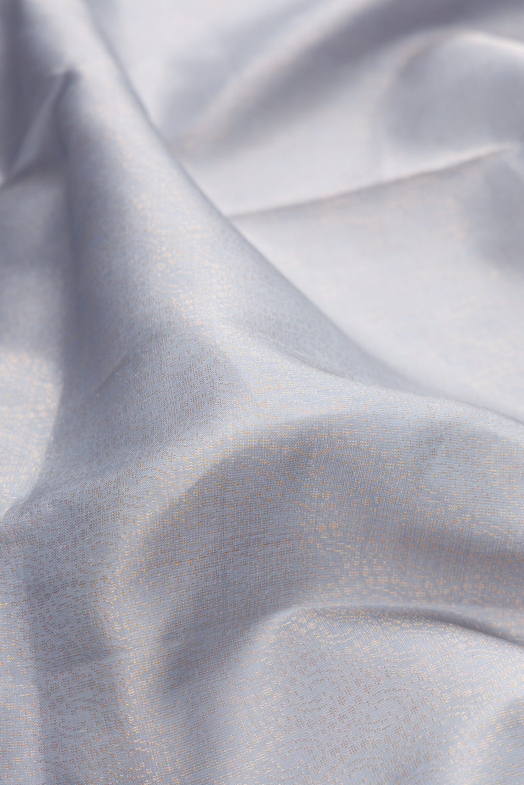 Close up of Pure Silk Light Blue Soft Saree with Zari Brocade on the body and Fancy Border.  displaying folds