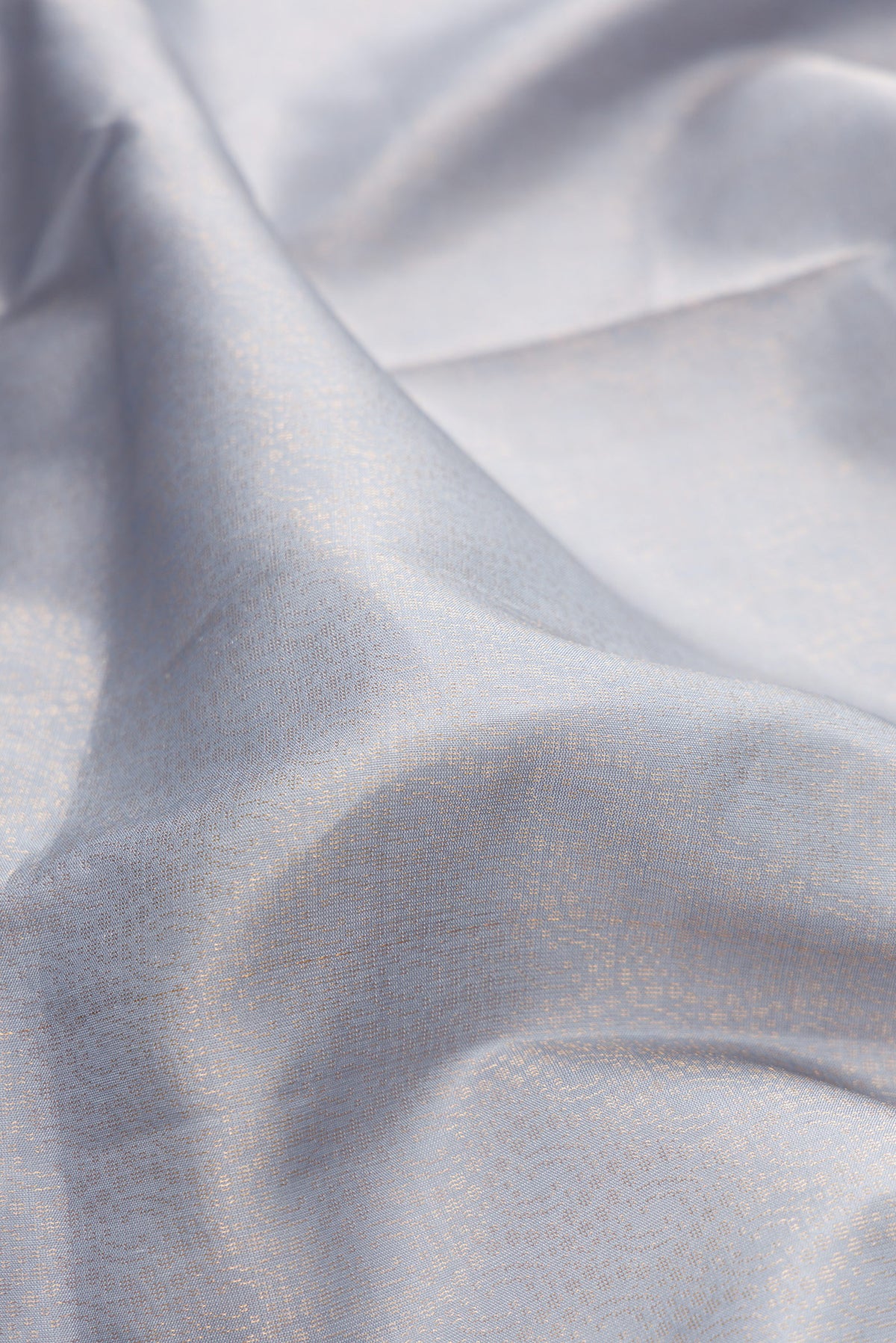 Close up of Pure Silk Light Blue Soft Saree with Zari Brocade on the body and Fancy Border.  displaying folds