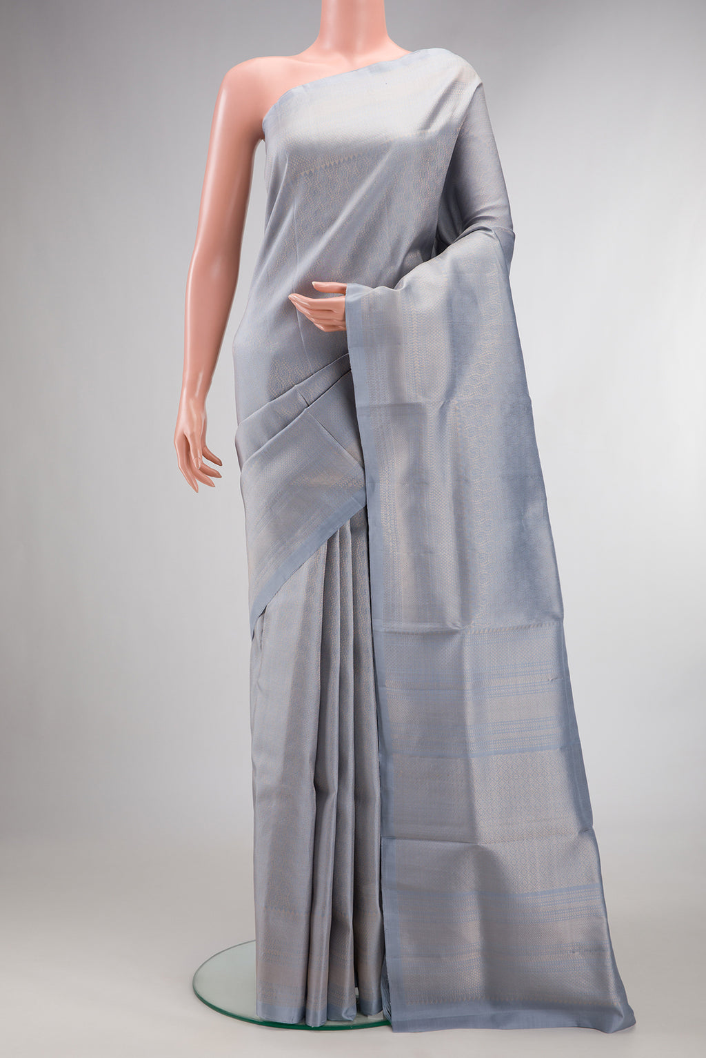 Pure Silk Light Blue Soft Saree with Zari Brocade on the body and Fancy Border.  displayed on a mannequin