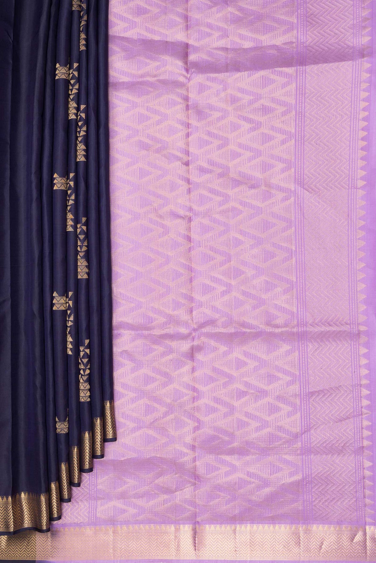 Pleats and pallu of Pure Silk Navy Blue Soft Saree with Zari Butta on the body and Zari Border. 
