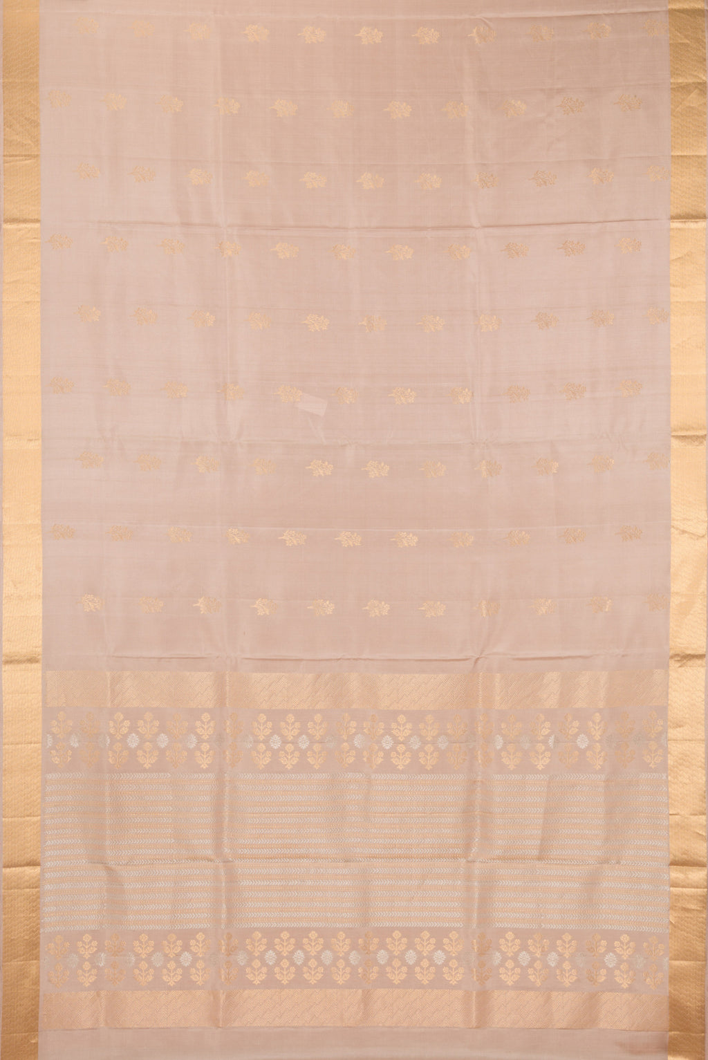 Flat view of Pure Silk Beige Soft Saree with Zari Butta on the body and Zari Border. 