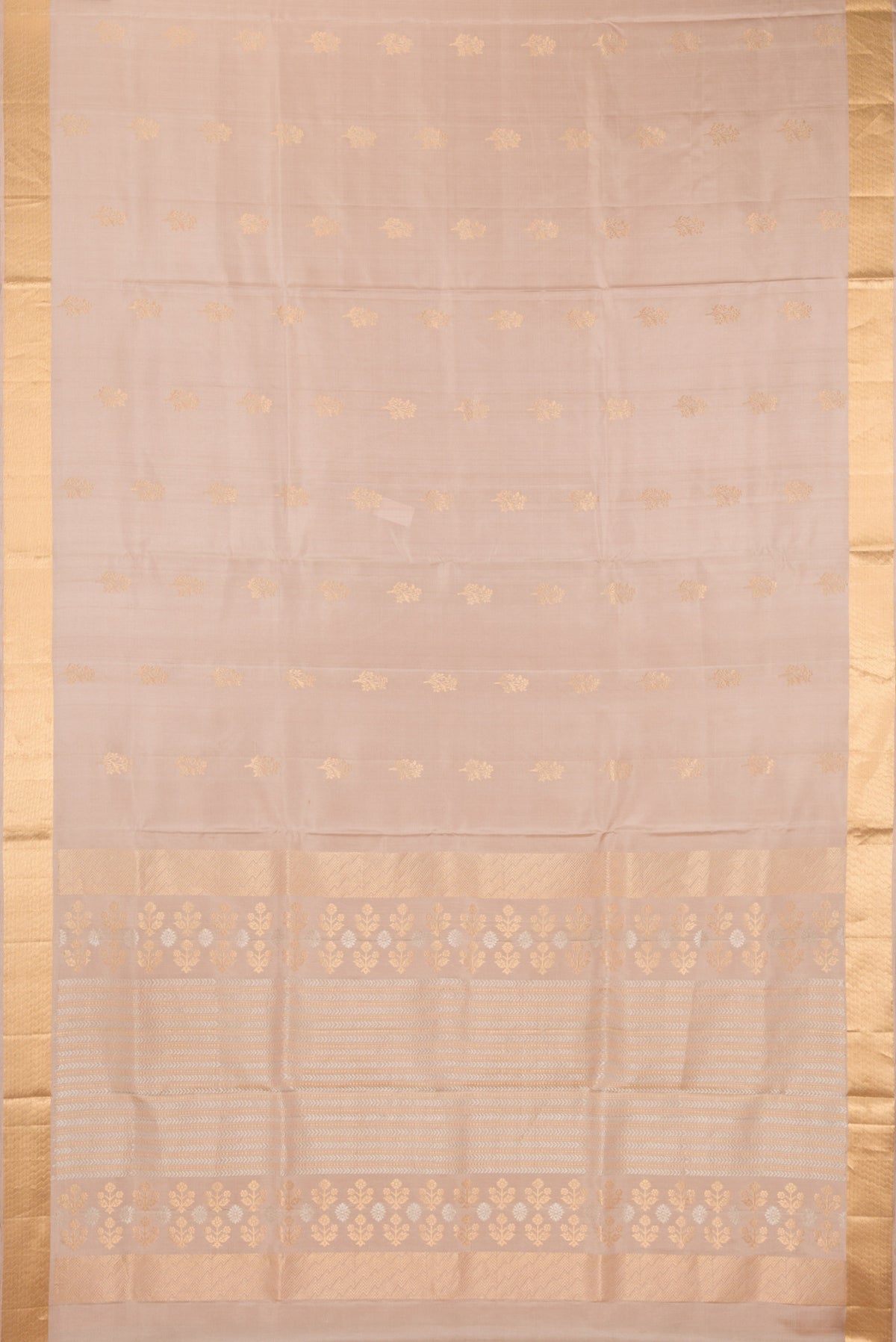 Flat view of Pure Silk Beige Soft Saree with Zari Butta on the body and Zari Border. 