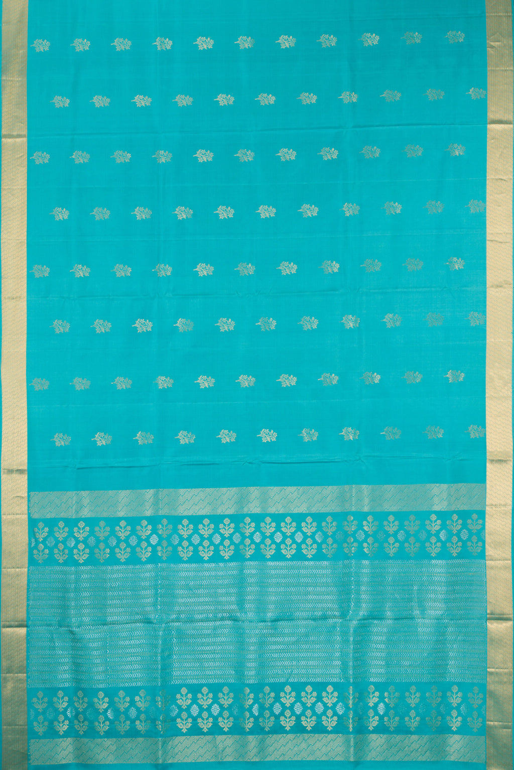 Flat view of Pure Silk Turquoise Soft Saree with Zari Butta on the body and Zari Border. 