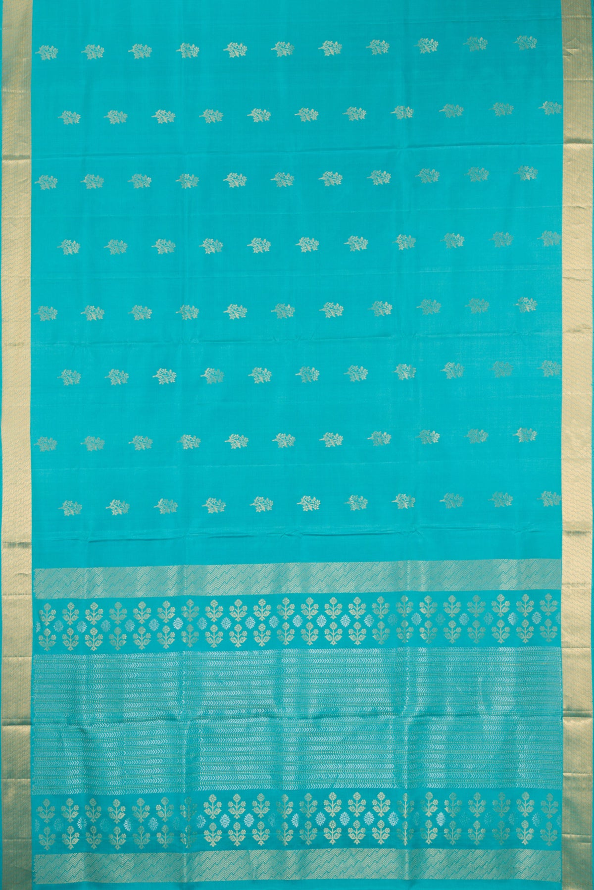 Flat view of Pure Silk Turquoise Soft Saree with Zari Butta on the body and Zari Border. 