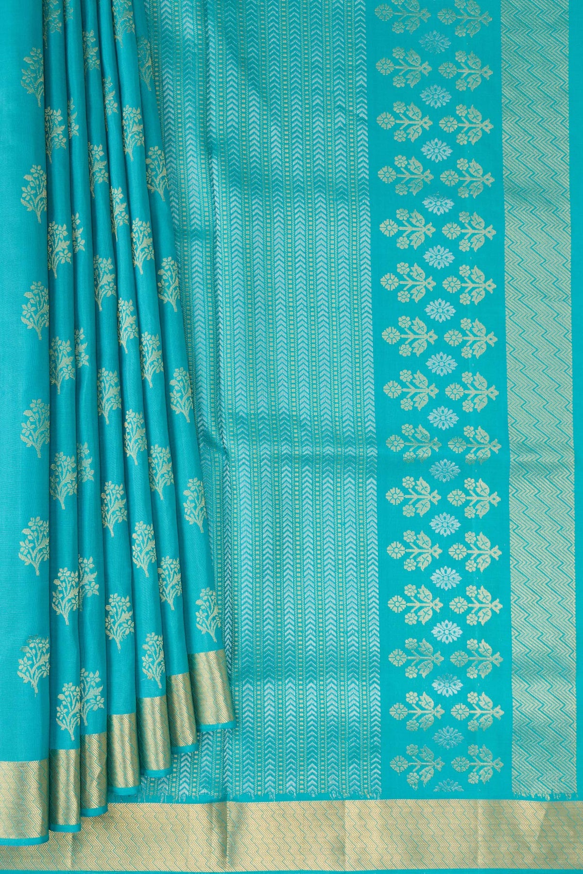 Pleats and pallu of Pure Silk Turquoise Soft Saree with Zari Butta on the body and Zari Border. 