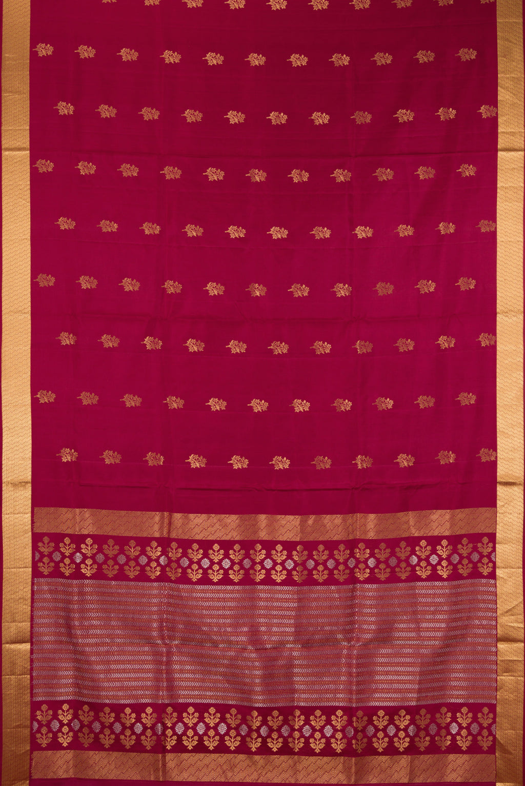 Flat view of Pure Silk Maroon Soft Saree with Zari Butta on the body and Zari Border. 