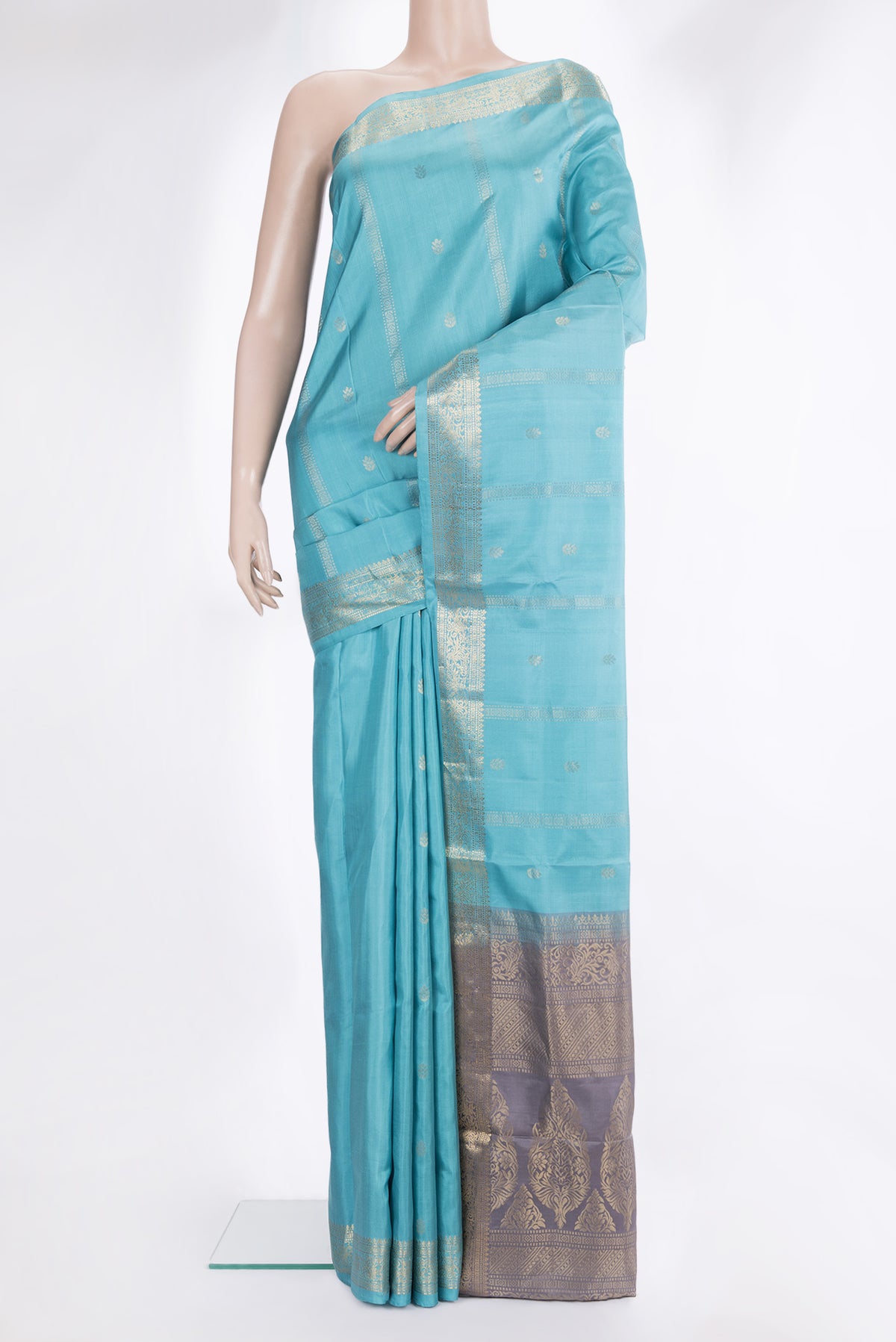 Pure Silk Sky Blue Soft Saree with Zari Butta on the body and Zari Border.  displayed on a mannequin