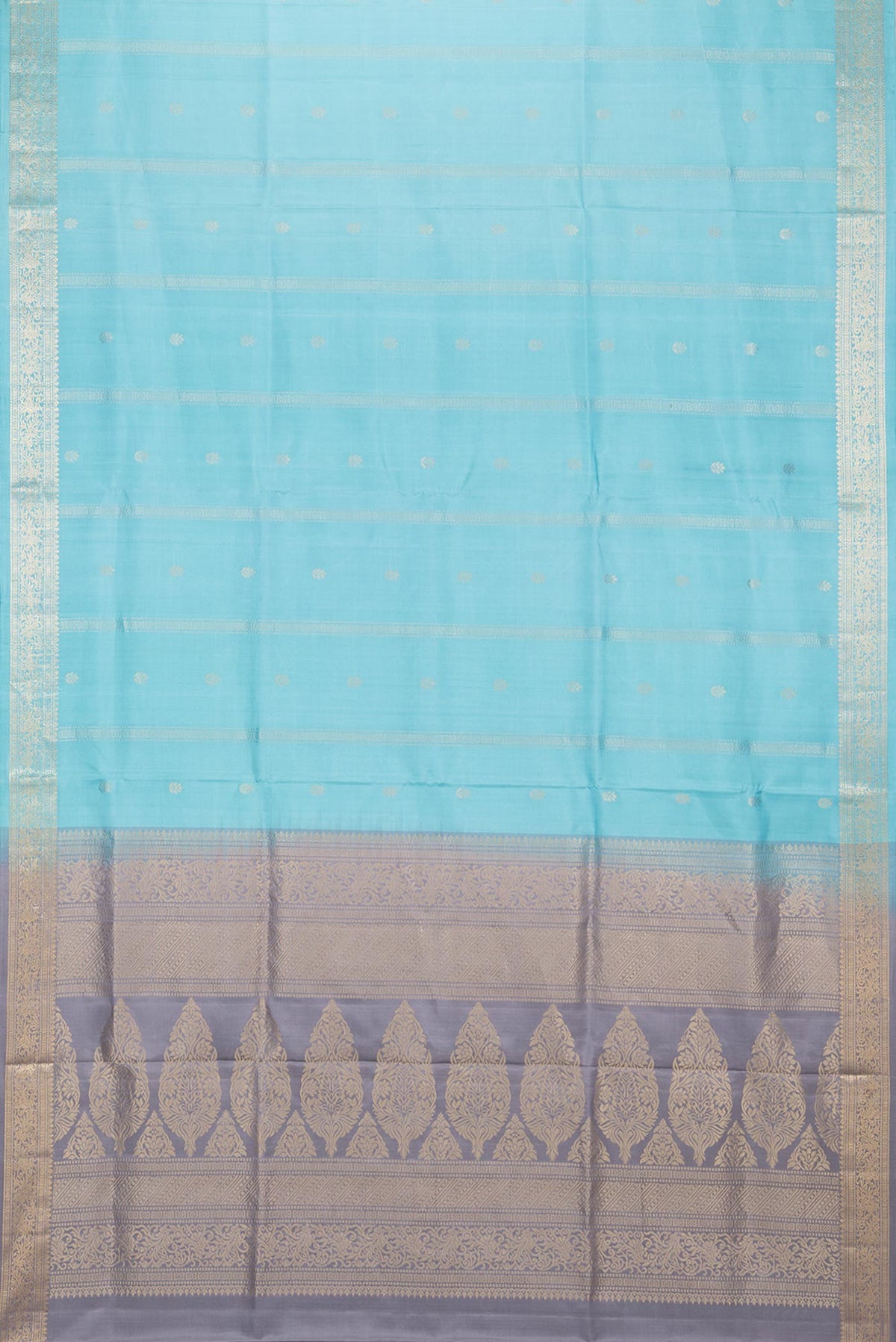 Flat view of Pure Silk Sky Blue Soft Saree with Zari Butta on the body and Zari Border. 