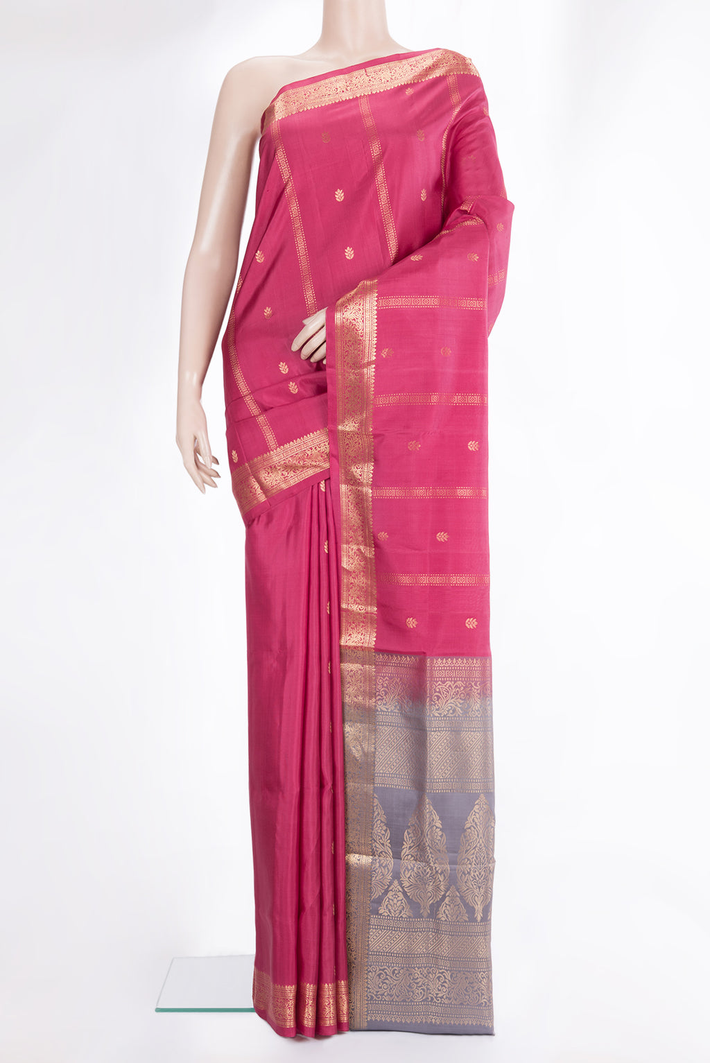 Pure Silk Pink Soft Saree with Zari Butta on the body and Zari Border.  displayed on a mannequin