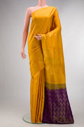Pure Silk Mustard Soft Saree with Zari Butta on the body and Without Border.  displayed on a mannequin