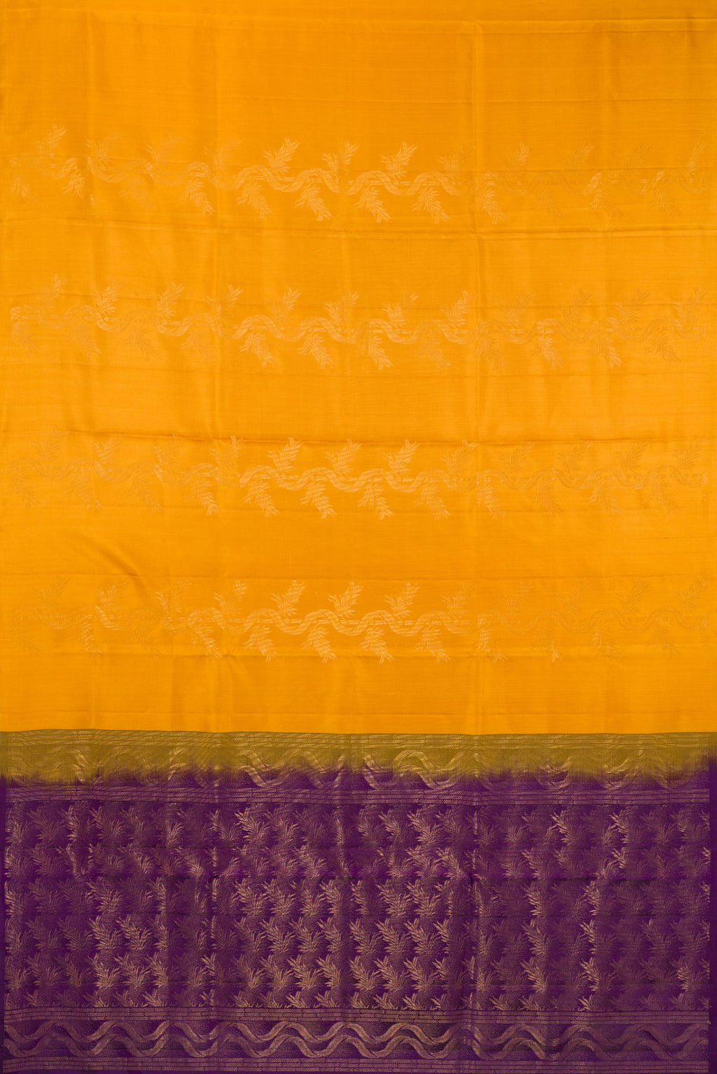 Flat view of Pure Silk Mustard Soft Saree with Zari Butta on the body and Without Border. 