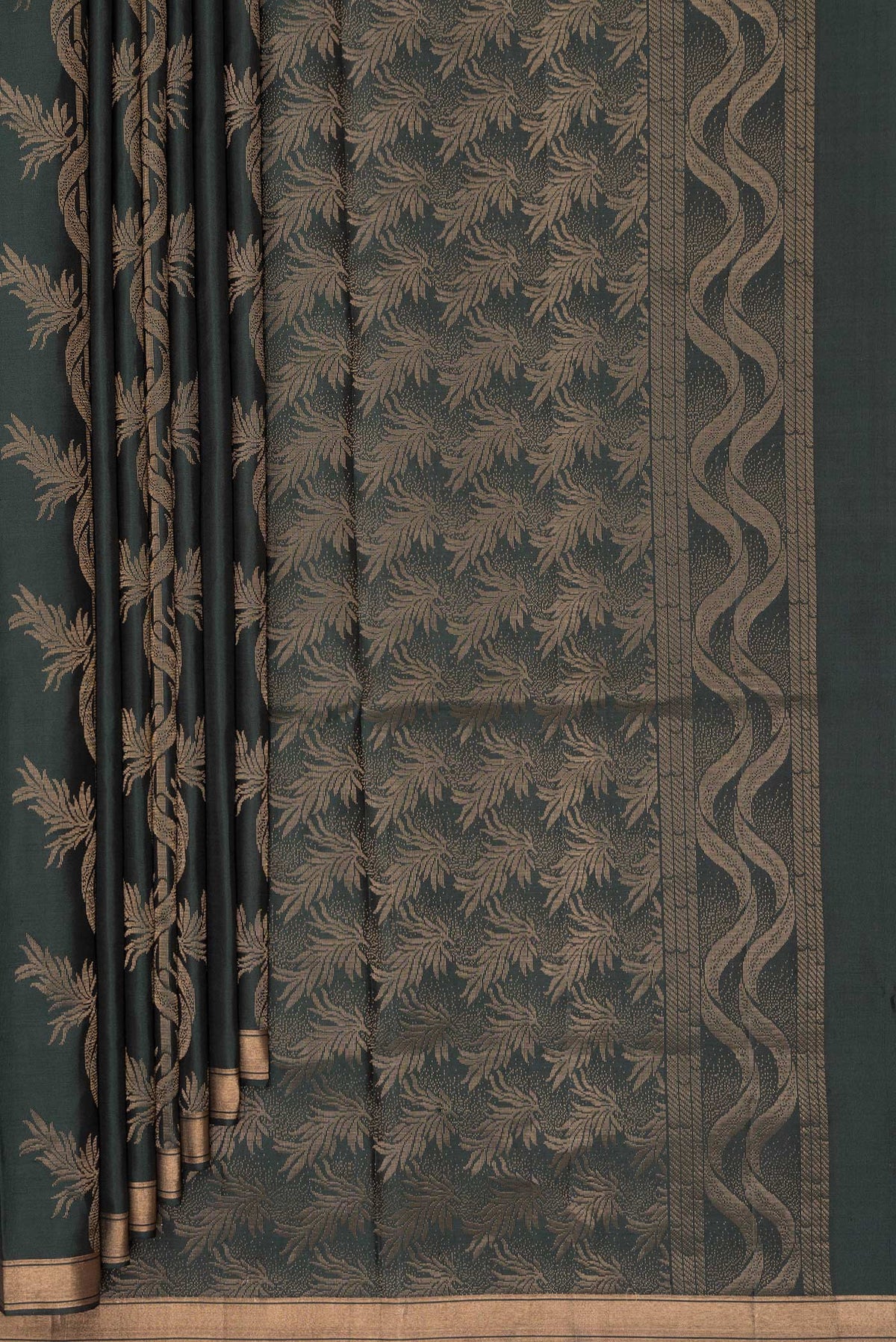 Pleats and pallu of Pure Silk Bottle Green Soft Saree with Zari Butta on the body and Zari Border. 