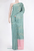 Pure Silk Mint Green Soft Saree with Zari Butta on the body and Without Border.  displayed on a mannequin