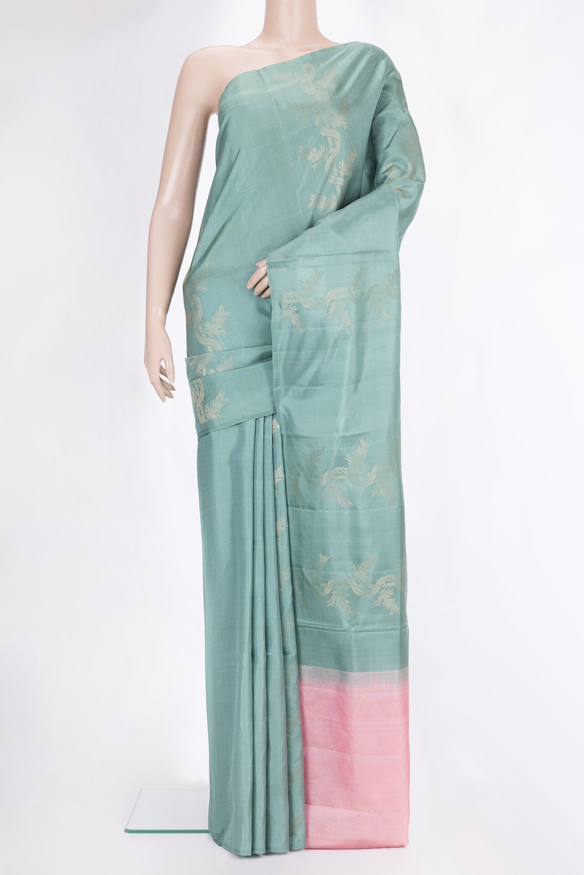 Pure Silk Mint Green Soft Saree with Zari Butta on the body and Without Border.  displayed on a mannequin