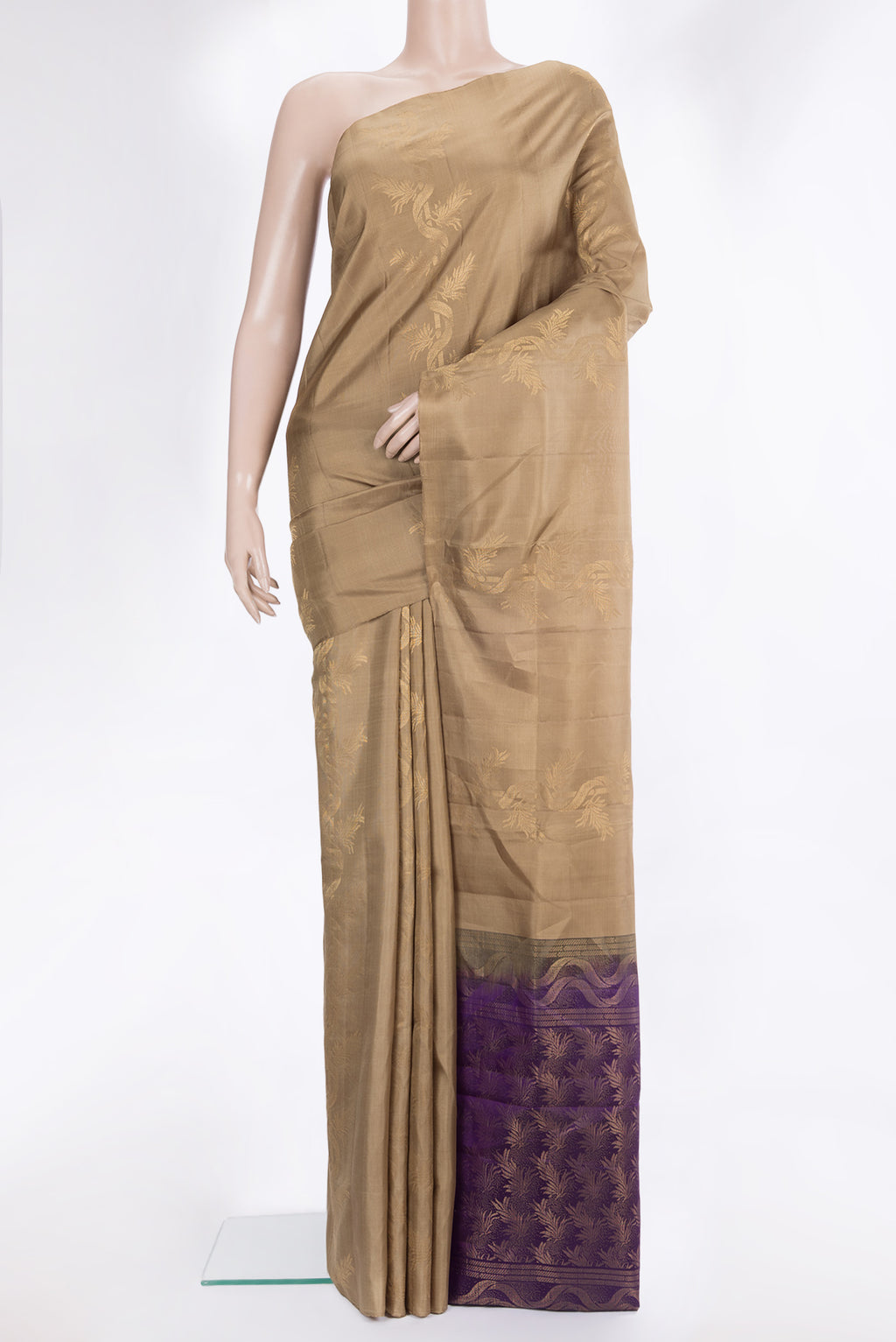 Pure Silk Beige Soft Saree with Zari Butta on the body and Without Border.  displayed on a mannequin