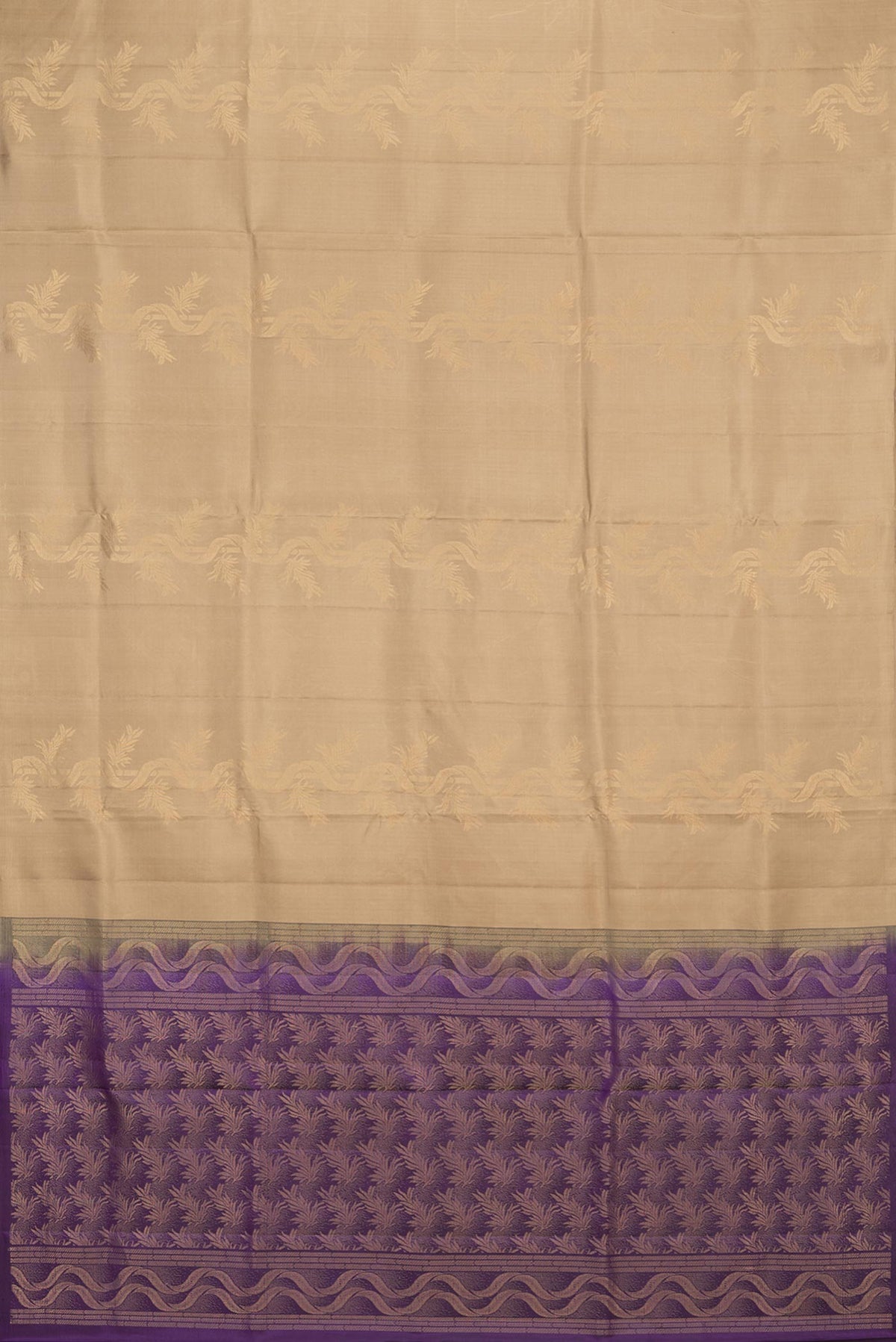 Flat view of Pure Silk Beige Soft Saree with Zari Butta on the body and Without Border. 