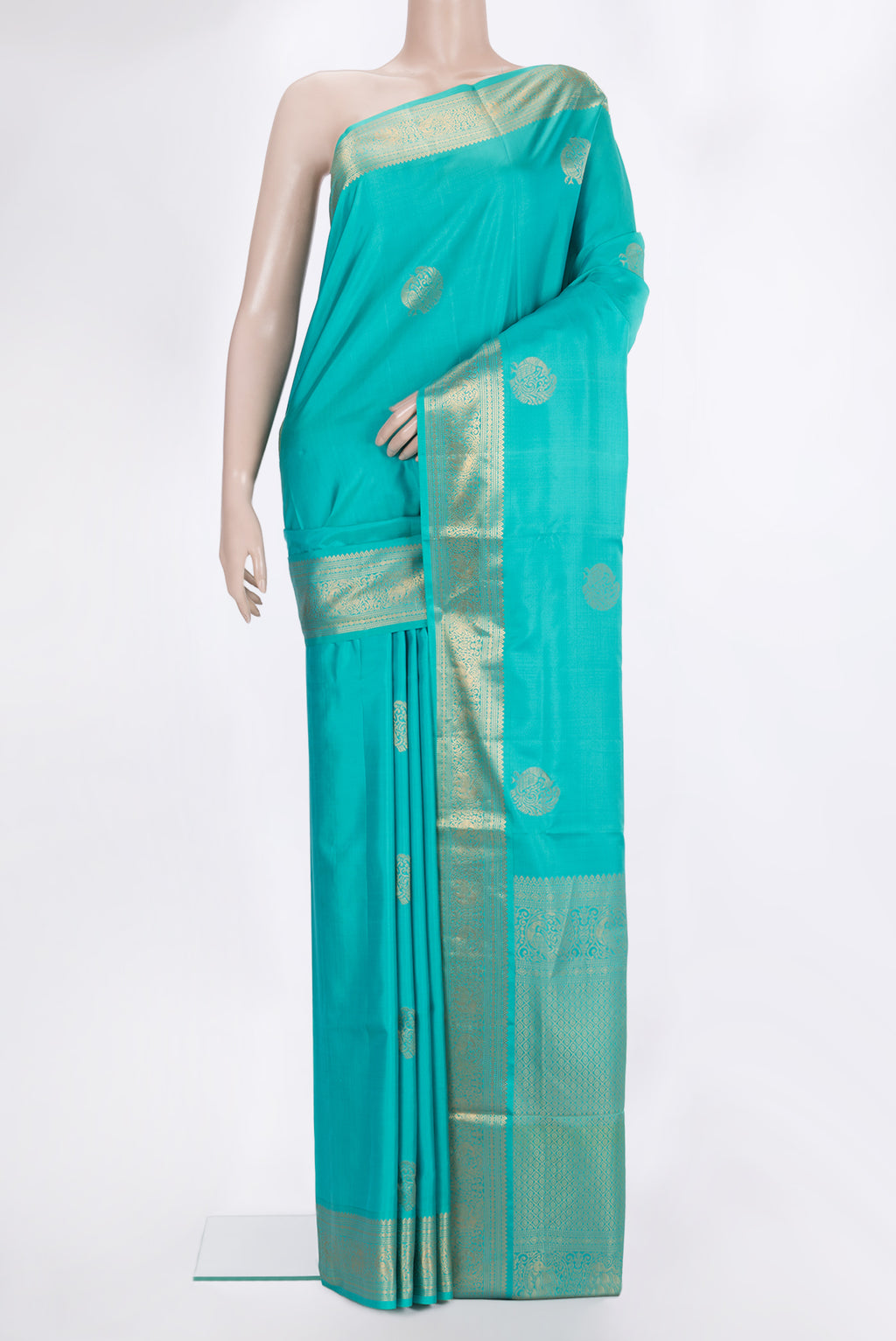 Pure Silk Turquoise Soft Saree with Zari Butta on the body and Zari Border.  displayed on a mannequin