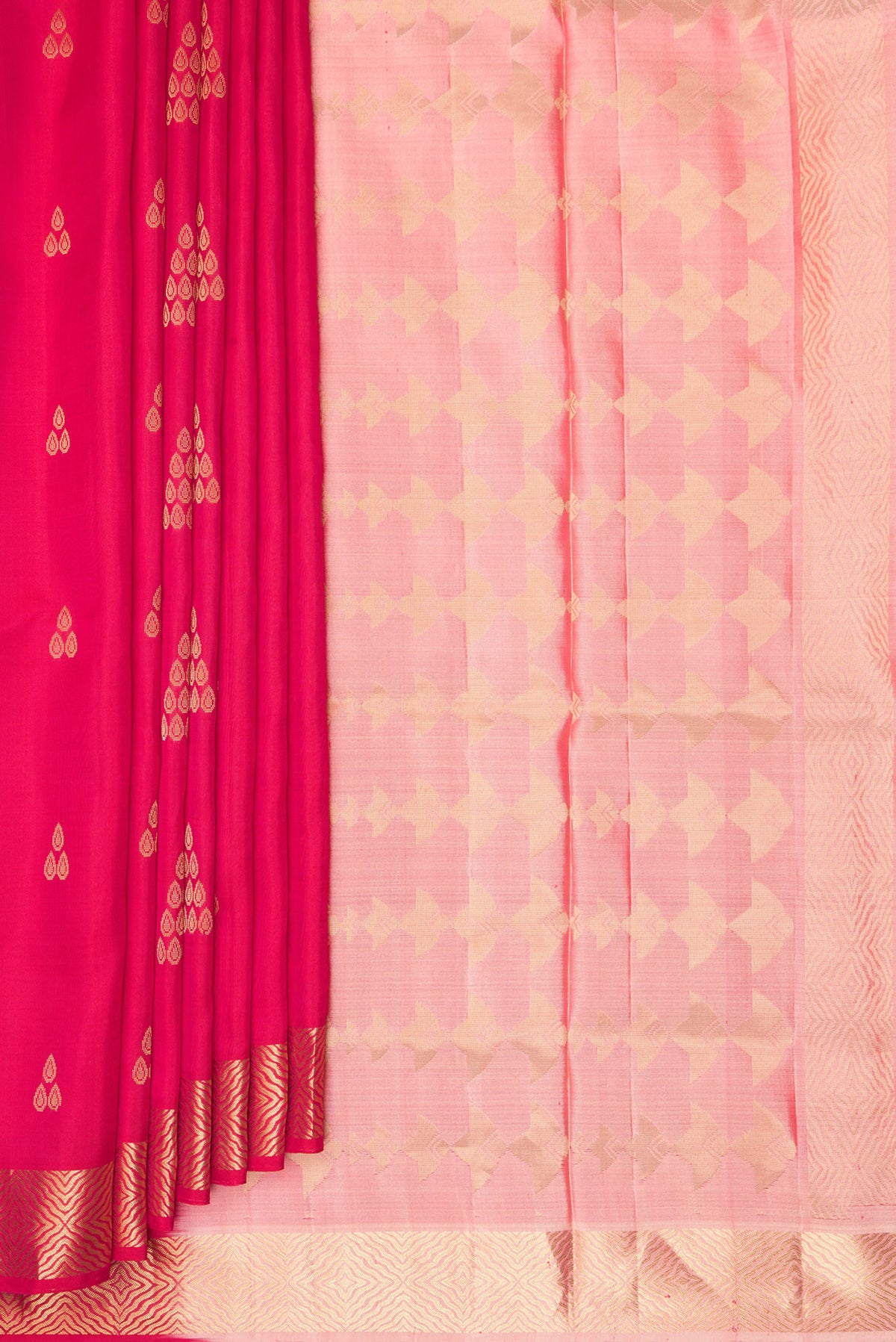 Pleats and pallu of Pure Silk Dark Pink Soft Saree with Zari Butta on the body and Zari Border. 