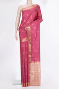 Pure Silk Coral Soft Saree with Zari Butta on the body and Zari Border.  displayed on a mannequin