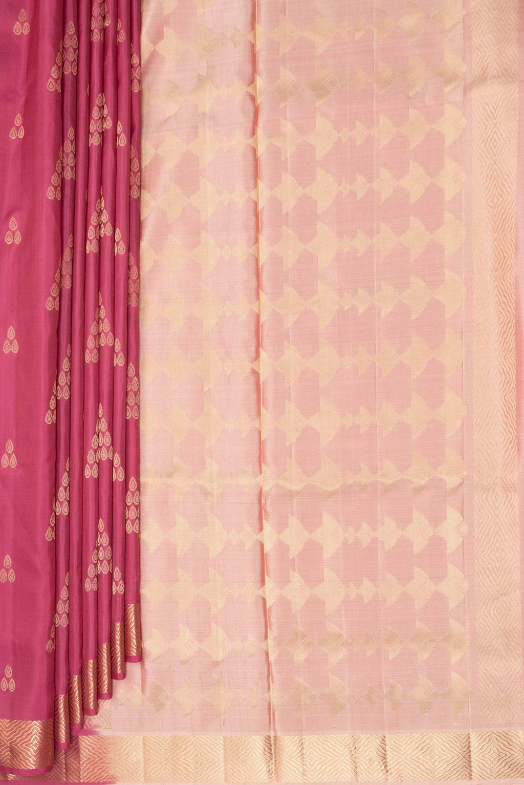 Pleats and pallu of Pure Silk Coral Soft Saree with Zari Butta on the body and Zari Border. 