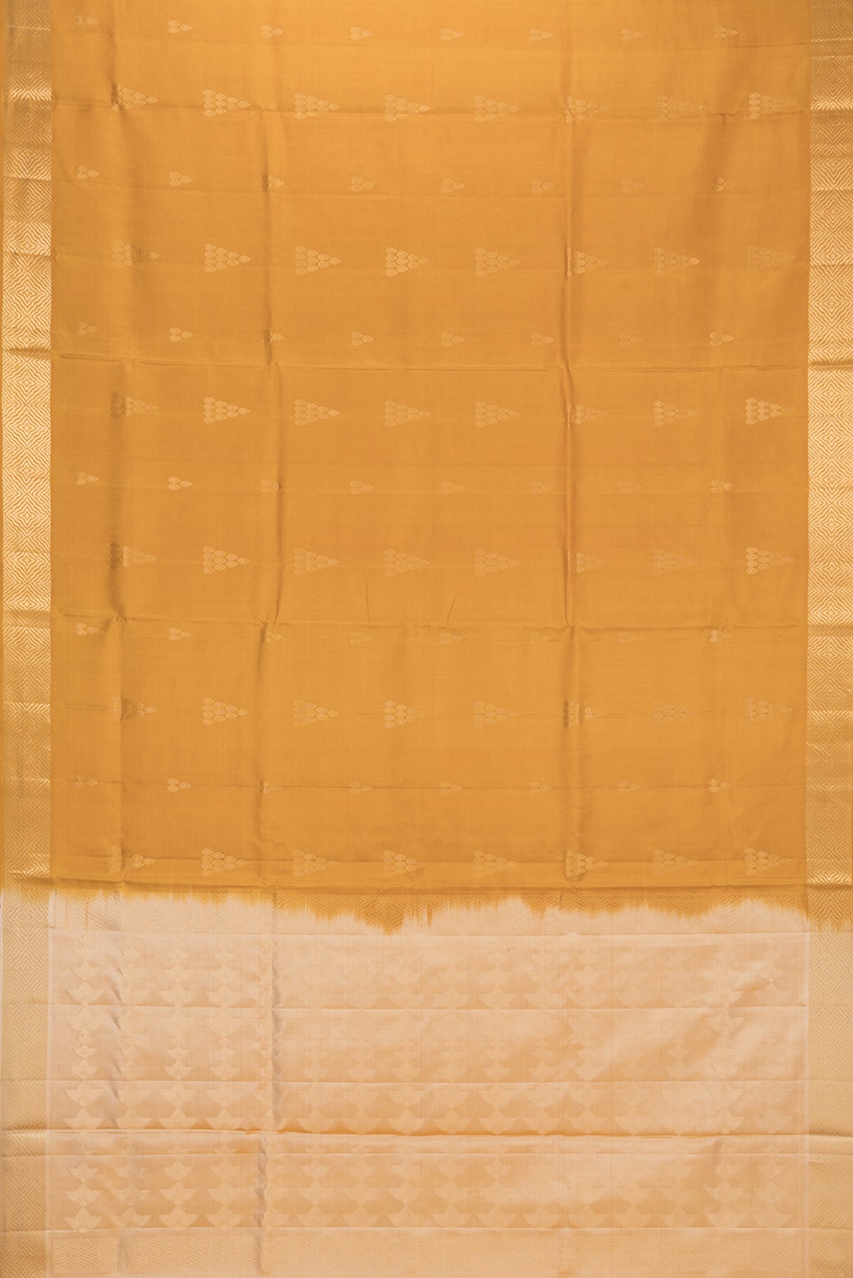 Flat view of Pure Silk Mustard Soft Saree with Zari Butta on the body and Zari Border. 