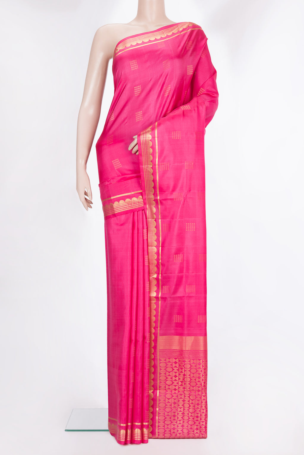 Pure Silk Pink Soft Saree with Zari Butta on the body and Zari Border.  displayed on a mannequin