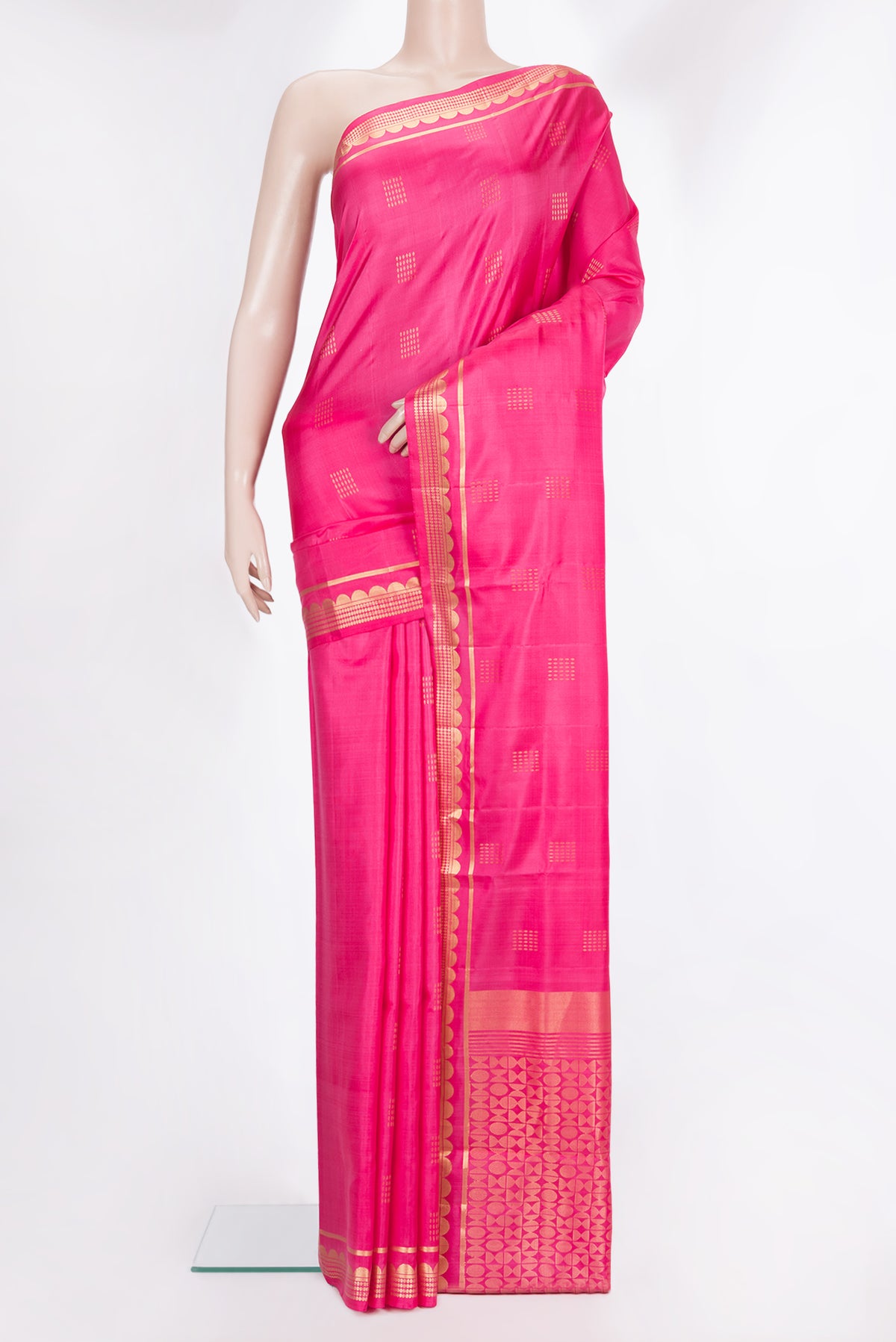 Pure Silk Pink Soft Saree with Zari Butta on the body and Zari Border.  displayed on a mannequin