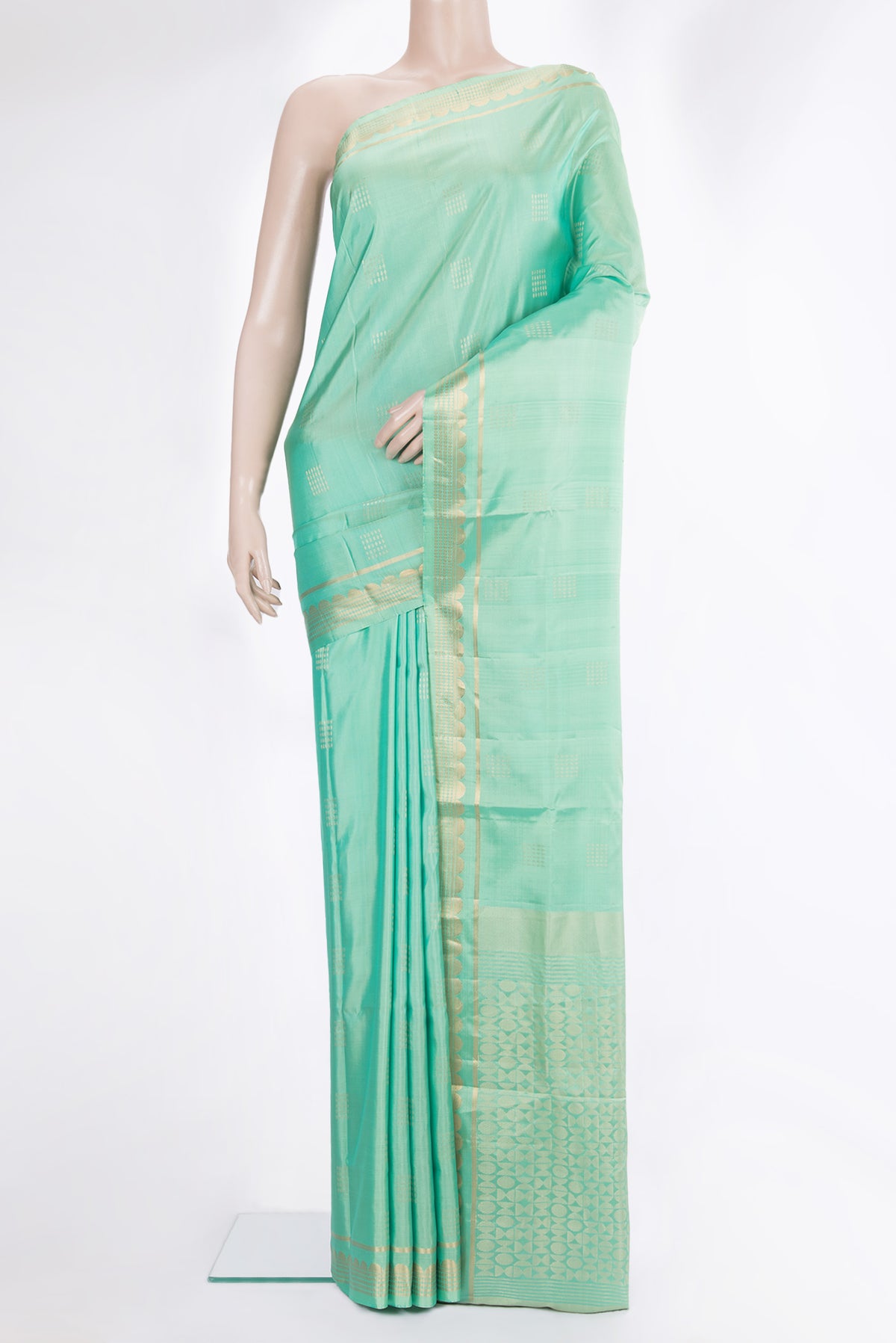 Pure Silk Pista Green Dual Tone Soft Saree with Zari Butta on the body and Zari Border.  displayed on a mannequin