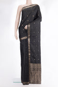 Pure Silk Black Soft Saree with Zari Butta on the body and Zari Border.  displayed on a mannequin