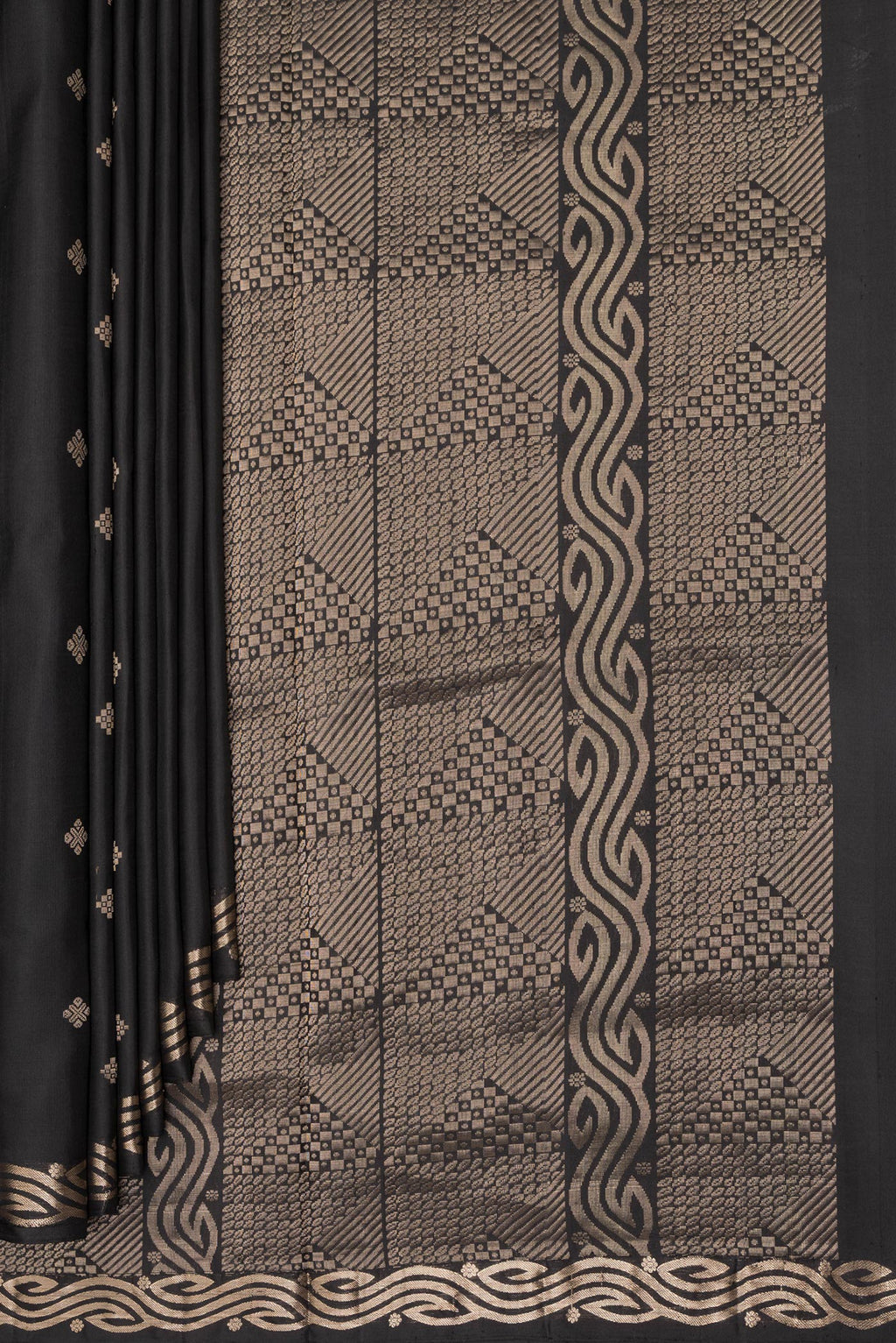 Pleats and pallu of Pure Silk Black Soft Saree with Zari Butta on the body and Zari Border. 
