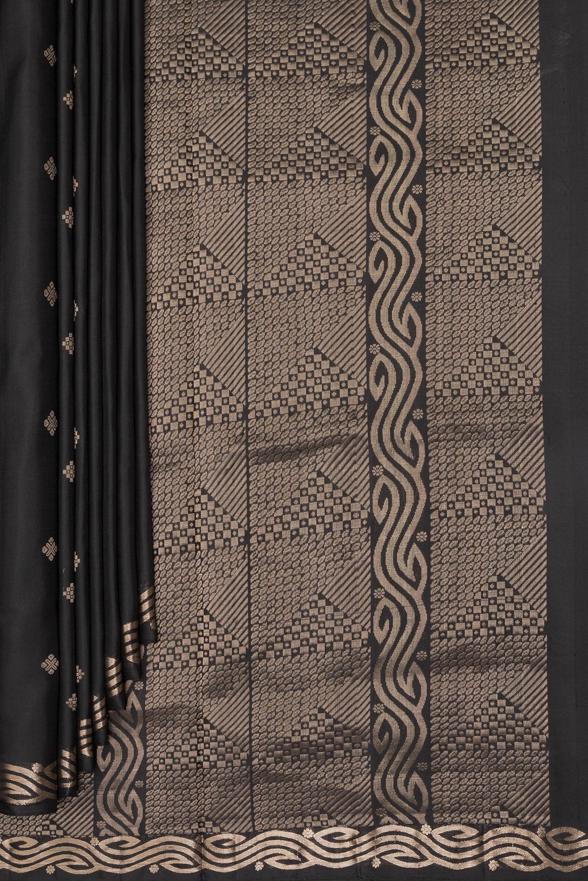 Pleats and pallu of Pure Silk Black Soft Saree with Zari Butta on the body and Zari Border. 